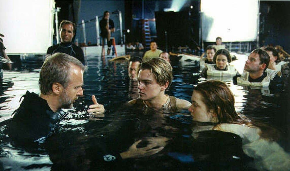 Director James Cameron giving directions to Leo and Kate on the set of The Titanic (1997)